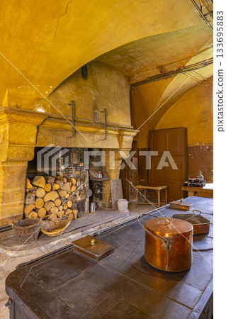 Traditional French kitchen interior in Chateau de Commarin Traditional French kitchen interior in Chateau de Commarin 133695883