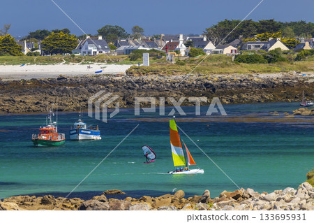 Coastal village with beach and water sports activity on a sunny day in Brittany Coastal village with beach and water sports activity on a sunny day in Brittany 133695931