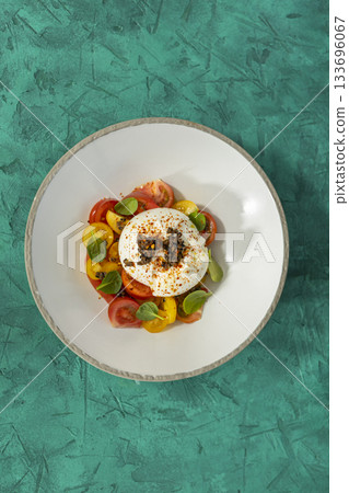 Burrata cheese salad with fresh colorful tomatoes 133696067