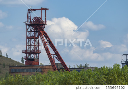 Mine headframe standing in Zacler, Czechia with blue sky 133696102