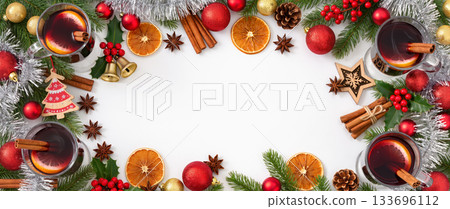 Christmas mulled wine with cinnamon, orange and spices in glass mugs surrounded by festive decor on white background. Top view flat lay. Christmas mulled wine with cinnamon, orange and spices in glass mugs surrounded by festive decor on white background. Top view flat lay. 133696112