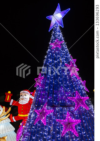 Christmas tree with blue lights and Santa Claus lantern Christmas tree with blue lights and Santa Claus lantern 133696293