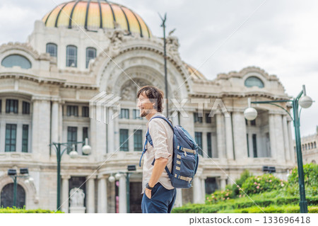 Male tourist standing in front of Palacio de Bellas Artes in Mexico City, highlighting travel, architecture, and cultural heritage. Urban tourism and exploration concept 133696418
