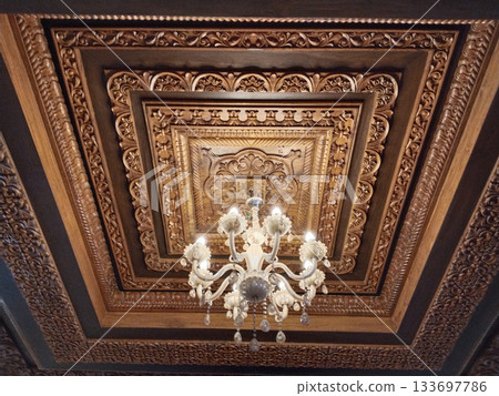 Classic chandelier hanging on cravings furniture ceiling Classic chandelier hanging on cravings furniture ceiling 133697786