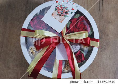 Marshmallow flowers in a hat box, box tied with ribbons, marshmallow tulips and roses, homemade marshmallow, brand tags 133698630