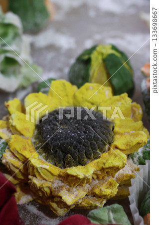 Marshmallow flowers in a container, marshmallow sunflower close-up, homemade marshmallow Marshmallow flowers in a container, marshmallow sunflower close-up, homemade marshmallow 133698667