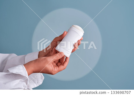 Hands holding white deodorant stick personal hygiene Hands holding white deodorant stick personal hygiene 133698707