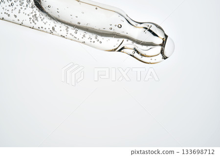 Cosmetic pipette dispensing serum with bubbles and liquid Cosmetic pipette dispensing serum with bubbles and liquid 133698712