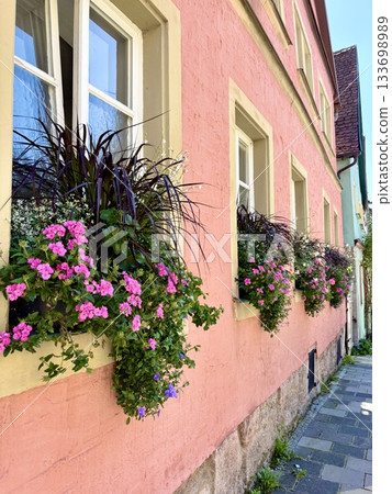 European house with pink walls and flowers European house with pink walls and flowers 133698989