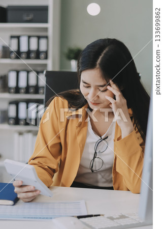 Headache, business woman at night and computer stress while working for a deadline with pc glitch. Sad corporate manager with anxiety about target working at desk screen late to complete task online Headache, business woman at night and computer stress while working for a deadline with pc glitch. Sad corporate manager with anxiety about target working at desk screen late to complete task online 133699862