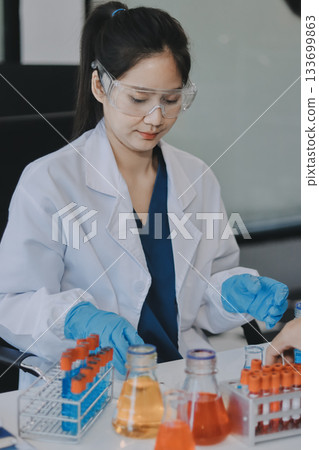 Portrait, science and happy woman on laptop in lab to research chemistry, test or innovation. Microscope, scientist and face of medical doctor in goggles for microbiology, healthcare or pharma study Portrait, science and happy woman on laptop in lab to research chemistry, test or innovation. Microscope, scientist and face of medical doctor in goggles for microbiology, healthcare or pharma study 133699863