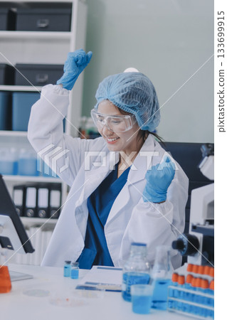 Portrait, science and happy woman on laptop in lab to research chemistry, test or innovation. Microscope, scientist and face of medical doctor in goggles for microbiology, healthcare or pharma study Portrait, science and happy woman on laptop in lab to research chemistry, test or innovation. Microscope, scientist and face of medical doctor in goggles for microbiology, healthcare or pharma study 133699915