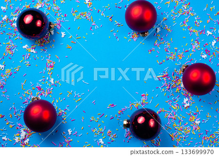 Red Christmas balls on a blue background. Happy New Year and Christmas designs With space for text. 133699970