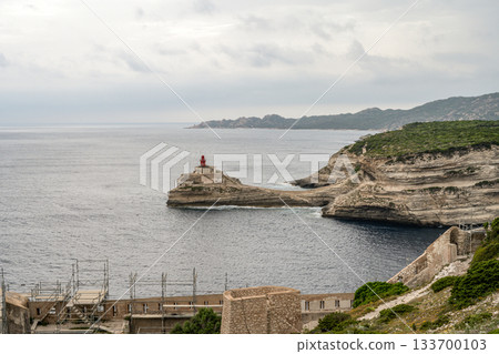 Aerial view marina cape Bonifacio south Corsica France citadel on rocky promontory on wild white limestone cliffs 133700103