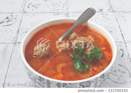 Romanian soup with meatballs, vegetable soup with meatballs, tiled table, homemade, no people, 133700193