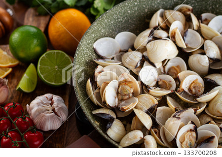 cooking, vongole clams, in a pan with spices and white wine, top view, no people, 133700208