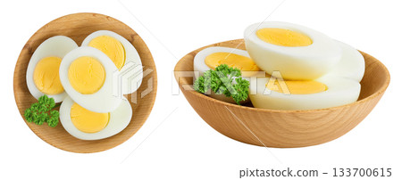 Boiled chicken egg in wooden bowl isolated on white background. Top view. Flat lay Boiled chicken egg in wooden bowl isolated on white background. Top view. Flat lay 133700615