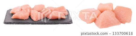 Raw diced chicken fillet on the black board isolated on white background with full depth of field. 133700618