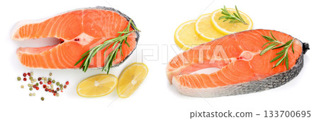Slice of red fish salmon with lemon, rosemary and peppercorns isolated on white background. Top view. Flat lay 133700695