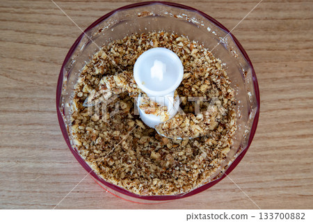 ground peanuts in a plastic blender  133700882