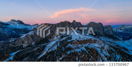 Panoramic view of Dolomite mountain peaks in beautiful morning light. Early winter scene with snow-covered summits, captured in high resolution, perfect for large fine art prints. 133700967