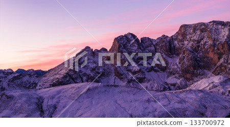 Panoramic view of Dolomite mountain peaks in beautiful morning light. Early winter scene with snow-covered summits, captured in high resolution. perfect for large fine art prints. Panoramic view of Dolomite mountain peaks in beautiful morning light. Early winter scene with snow-covered summits, captured in high resolution. perfect for large fine art prints. 133700972