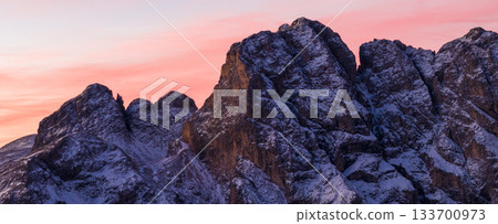 Panoramic view of Dolomite mountain peaks in beautiful morning light. Early winter scene with snow-covered summits, captured in high resolution. perfect for large fine art prints. 133700973