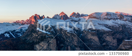 Panoramic view of Dolomite mountain peaks in beautiful morning light. Early winter scene with snow-covered summits, captured in high resolution. perfect for large fine art prints. 133700980