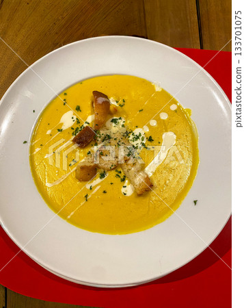 Creamy Pumpkin Soup with Croutons 133701075