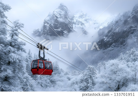 A red cable car gliding through a snowy mountain forest surrounded by mist and cliffs A red cable car gliding through a snowy mountain forest surrounded by mist and cliffs 133701951