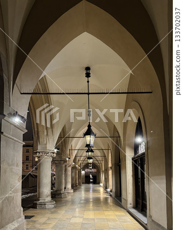 Night scene of Historic Sukiennice Cloth Hall Arcades in Old Town Krakow, Poland 133702037