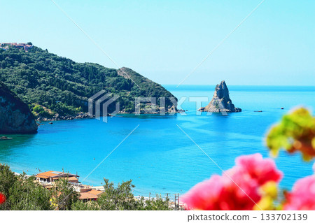 View of the picturesque Bay of Agios Gordios from above. Corfu island, Greece. View of the picturesque Bay of Agios Gordios from above. Corfu island, Greece. 133702139