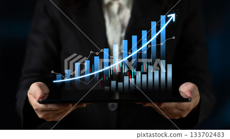 Business professional holding tablet displaying dynamic data visualization with graphs, charts, and upward trends in a modern financial setting Scalp Business professional holding tablet displaying dynamic data visualization with graphs, charts, and upward trends in a modern financial setting Scalp 133702483