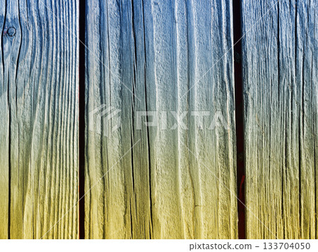 Wooden plank background in Ukrainian style, painted in the colors of the Ukrainian flag 133704050