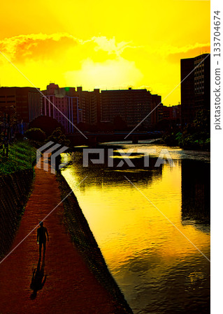 Sunset reflected on the river surface Sunset reflected on the river surface 133704674