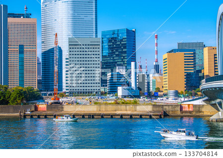 Tokyo cityscape in Japan: View of the Shiodome buildings and the former Tsukiji Market (6) including the temporary access road and removal of the upper structure of the loading pier Tokyo cityscape in Japan: View of the Shiodome buildings and the former Tsukiji Market (6) including the temporary access road and removal of the upper structure of the loading pier 133704814