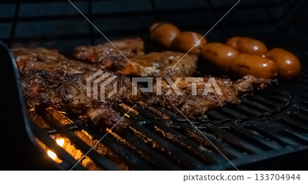Grilled Meat and Sausages on Hot Barbecue Grill Grilled Meat and Sausages on Hot Barbecue Grill 133704944
