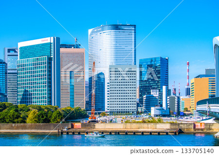 Tokyo cityscape in Japan: View of the Shiodome buildings and the former Tsukiji Market (6) including the temporary access road and removal of the upper structure of the loading pier 133705140