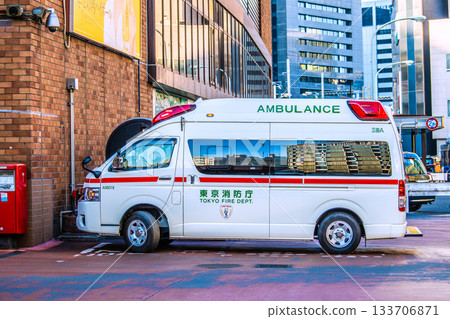 Tokyo cityscape in Japan. An ambulance dispatched in front of Shimbashi Station. 133706871