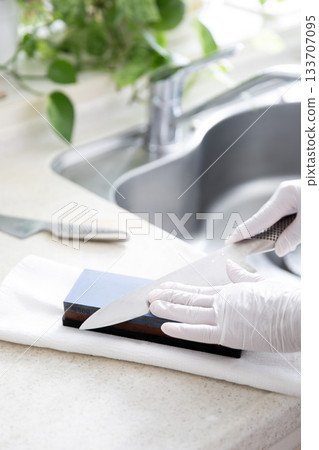 Knife sharpening in the kitchen Knife sharpening in the kitchen 133707095