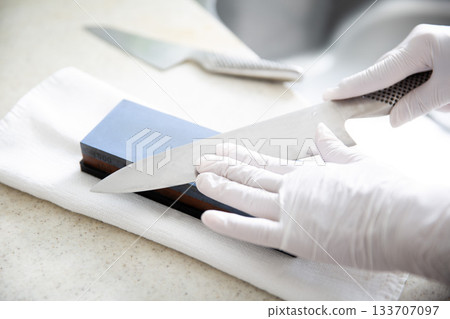 Knife sharpening in the kitchen 133707097