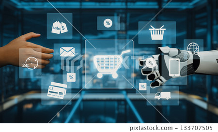 Futuristic Shopping Experience with Robotic Hand and Human Interaction Featuring E-commerce Icons and Symbols in a Modern Digital Environment. Auvana Futuristic Shopping Experience with Robotic Hand and Human Interaction Featuring E-commerce Icons and Symbols in a Modern Digital Environment. Auvana 133707505