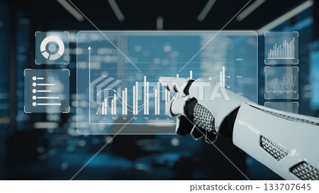 Futuristic Robot Hand Interacting with Advanced Data Analytics Dashboard in Modern Office Environment. Auvana 133707645