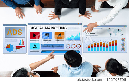 Group of professionals analyzing digital marketing data with graphs and charts on a modern touchscreen display in a bright office setting Trope Group of professionals analyzing digital marketing data with graphs and charts on a modern touchscreen display in a bright office setting Trope 133707706