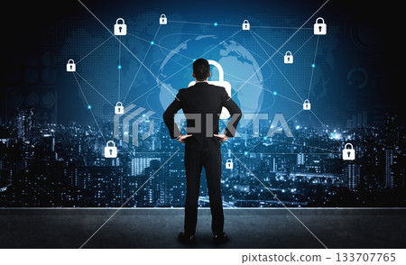 Businessman in Suit Analyzing Global Cybersecurity Network Visualization with Lock Icons, Cityscape Background, Modern Technology Concept Gantry 133707765