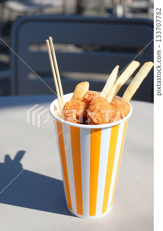 Fried chicken and fries in a takeout container Fried chicken and fries in a takeout container 133707782