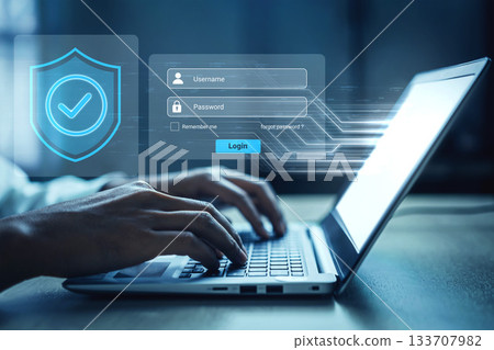 User enters login credentials on a laptop with security shield and password field in a digital and modern workspace environment Gantry User enters login credentials on a laptop with security shield and password field in a digital and modern workspace environment Gantry 133707982