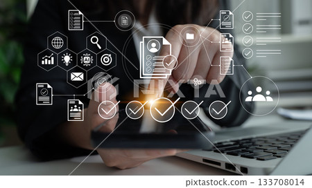 Person using smartphone for digital communication with abstract icons representing technology, business data, and workflow management concepts in an office setting Gantry Person using smartphone for digital communication with abstract icons representing technology, business data, and workflow management concepts in an office setting Gantry 133708014