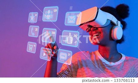 Enthusiastic Woman Engaging with Virtual Reality Interface, Exploring Digital Content and Social Media Connections in Modern Technology Environment. Raster 133708113