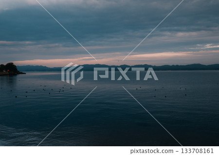 Dramatic clouds and light in the seascape 133708161